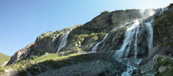 Panorama of a mountain range with waterfalls - Фото, изображение