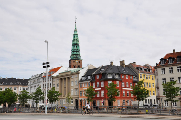 view of the street on which a young girl rides a bicycle, Copenhagen - Photo, Image