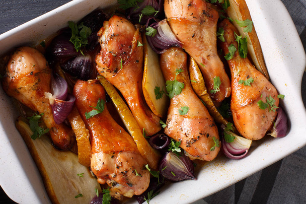 Chicken legs baked with red onions and greens in honey-soy sauce - Photo, Image