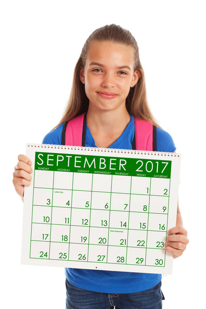 School: Student Holds Calendar And Ready For Back To School - 写真・画像