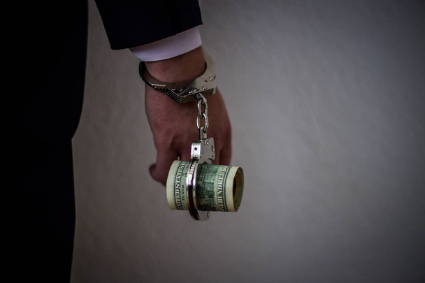 A businessman caught with handcuffs on his stomach for corruptio - Fotografie, Obrázek