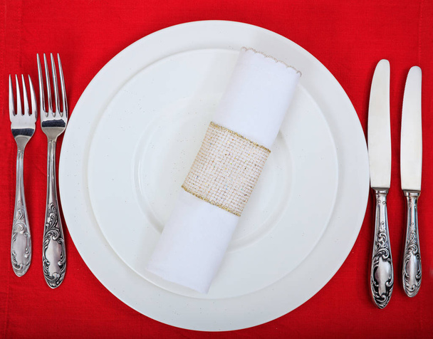 Formal table setting on red tablecloth - Photo, Image