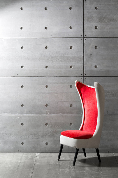 modern red chair and concrete wall. copy space - Photo, Image