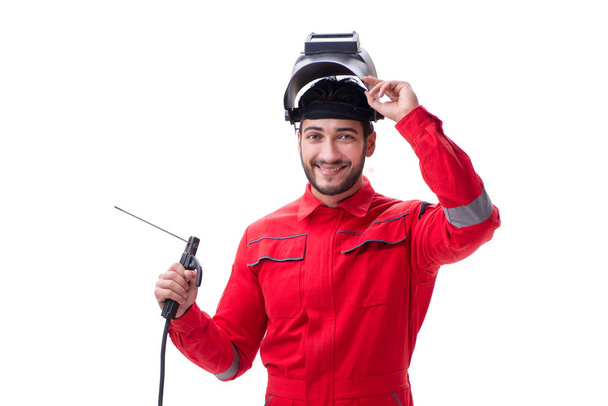 Reparador joven con un electrodo de pistola de soldadura y un casco aislado
 - Foto, imagen