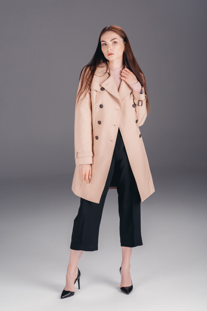 fashionable young woman in coat - Zdjęcie, obraz