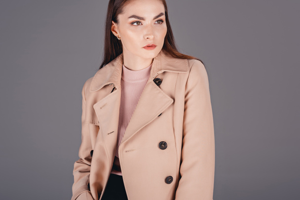 fashionable young woman in coat - Фото, изображение