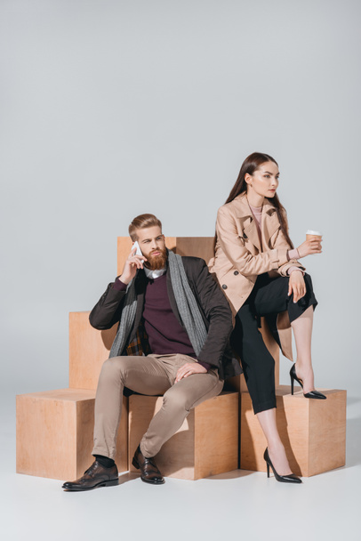 stylish couple with coffee to go and smartphone - Fotoğraf, Görsel