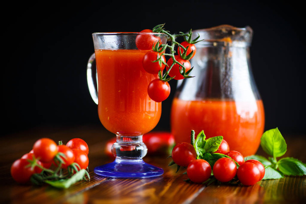 Homemade natural tomato juice in a decanter - Fotó, kép