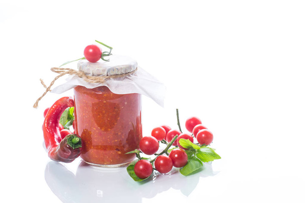 Homemade organic tomato sauce in a glass jar - 写真・画像