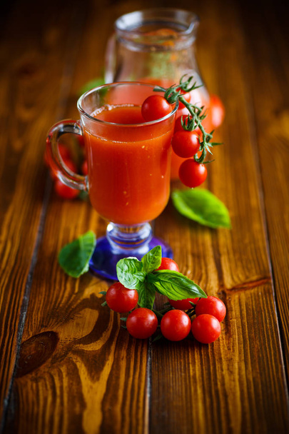 Homemade natural tomato juice in a decanter - Fotoğraf, Görsel