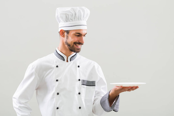 Chef  holding plate  - Fotó, kép