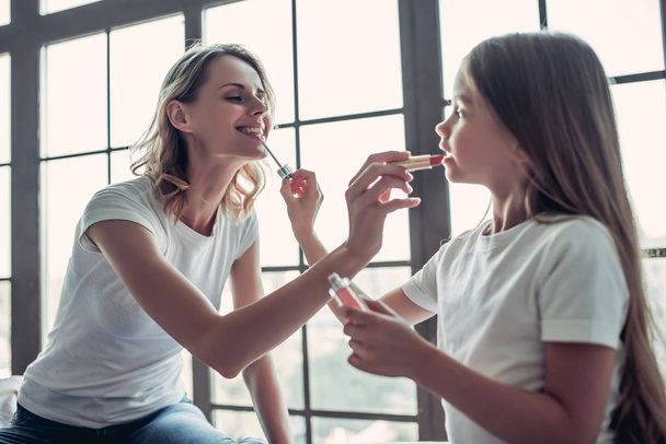 Mom with daughter doing makeup - Photo, Image