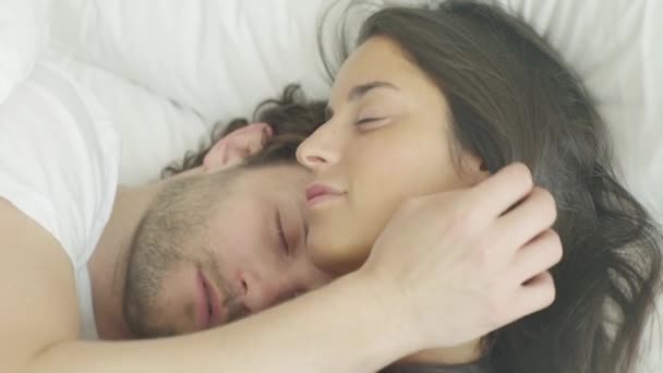 Couple sleeping in bed - Filmati, video