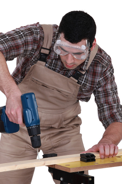 Handyman using a screwdriver - Фото, зображення