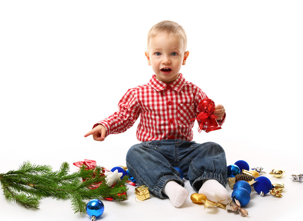 Criança com ramo de abeto e decoração de Natal
 - Foto, Imagem