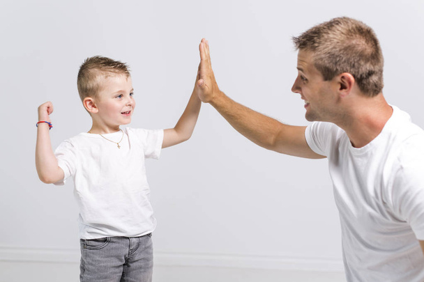 Handsome man with his son on white background - Foto, Imagen
