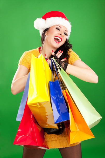 Fun santa woman with color packages - Foto, Imagem
