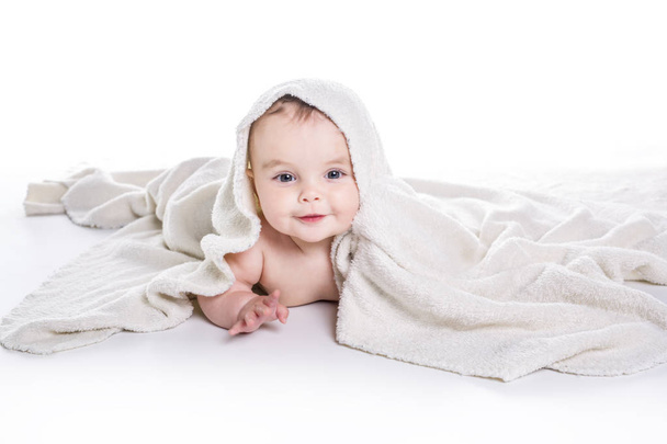 baby under a towel. isolated on a white background - Fotografie, Obrázek