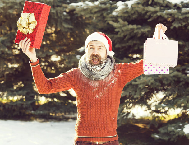handsome santa man opens presents - Foto, Imagem