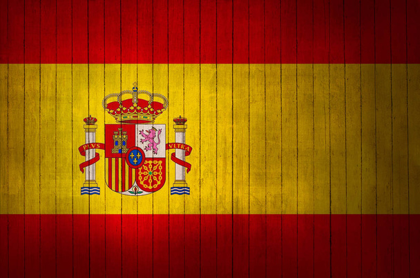 Spanish flag with the sign on a wooden background - Photo, Image