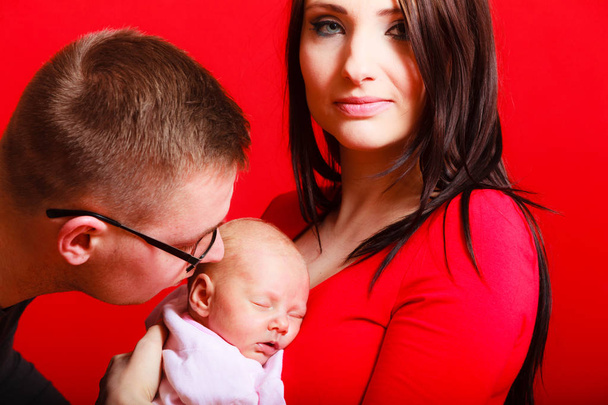 Newborn on mother chest father kissing baby - Fotografie, Obrázek