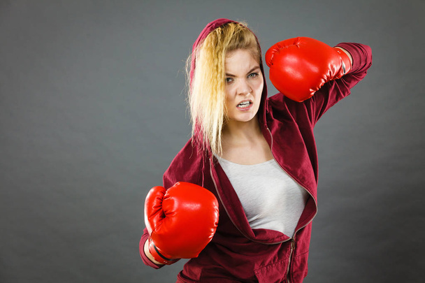 Woman wearing boxing gloves - Valokuva, kuva