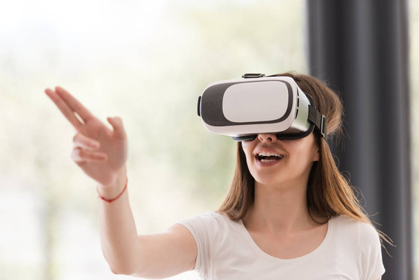 woman using VR-headset glasses of virtual reality - Photo, image