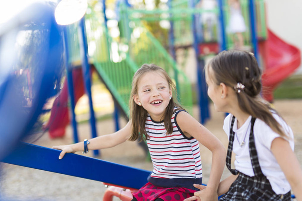 cheerful school age child play on playground school - Foto, imagen