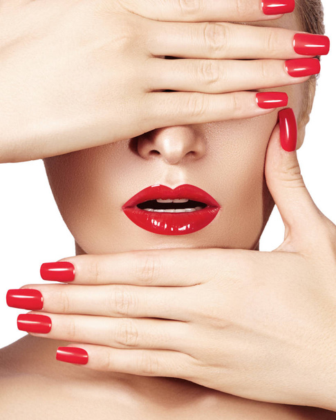 Red lips and bright manicured nails. Sexy open mouth. Beautiful manicure and makeup. Celebrate make up and clean skin - Photo, Image