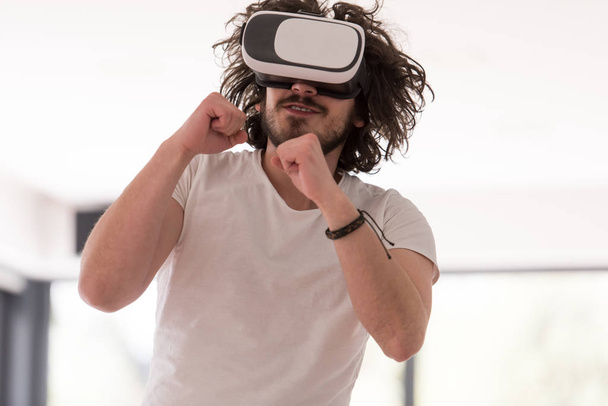 man using VR-headset glasses of virtual reality - Фото, изображение