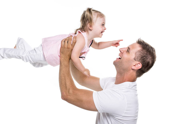 portrait of father holding his adorable child on white background - Foto, Imagem