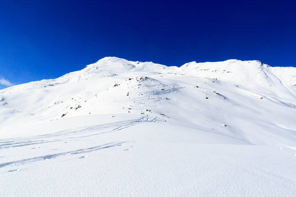 Mountain panorama with snow and ski tracks in winter in Stubai Alps, Austria - Photo, Image