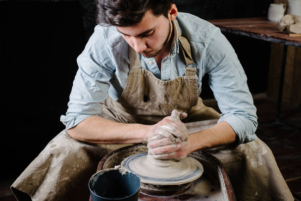 pottery, workshop, ceramics art concept - man working on potter' - Photo, Image
