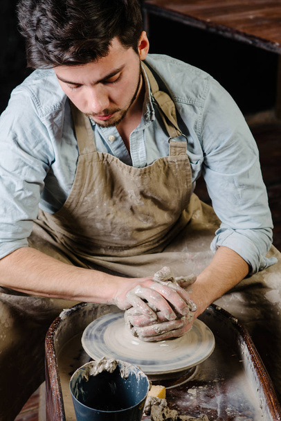 pottery, workshop, ceramics art concept - man working on potter' - Fotó, kép