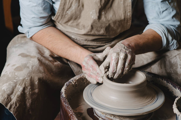 pottery, workshop, ceramics art concept - a master sits at the P - Φωτογραφία, εικόνα