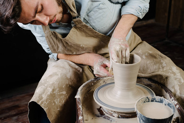 pottery, workshop, ceramics art concept - man working on potter' - Fotografie, Obrázek