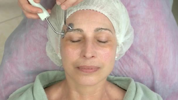 Microcurrent face treatment, mature woman. - Footage, Video