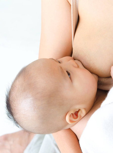 Baby drinking breastmilk - Photo, image