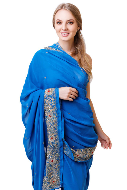 Caucasian young woman in blue indian national dress isolated - Fotó, kép