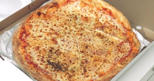 Woman rips off slice of tasty pizza - Video