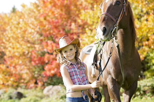 Autumn season young girl and horse - Fotoğraf, Görsel