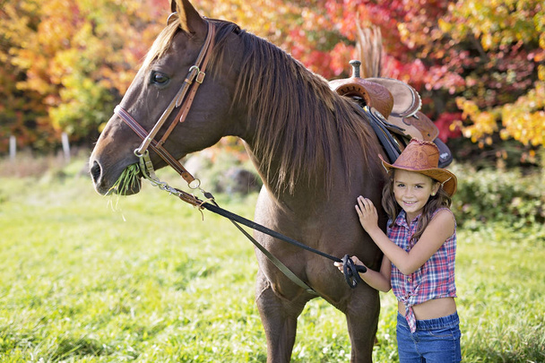 Autumn season young girl and horse - Fotoğraf, Görsel