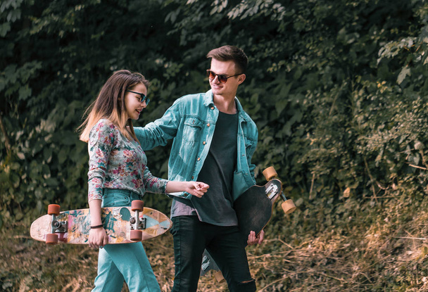 Hipster Couple with Skateboards - 写真・画像