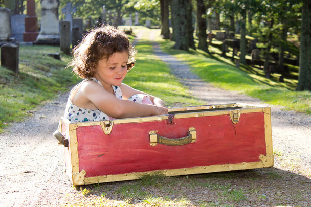 orphan girl in red suitcase  - Photo, Image