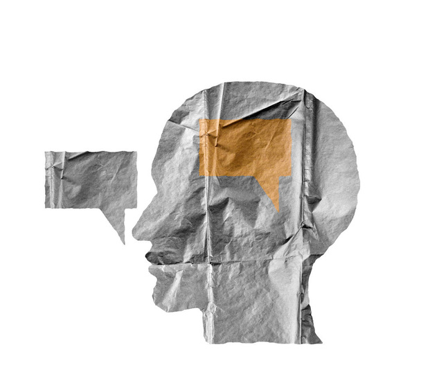 Crumpled paper shaped as a human head and talk balloon on white. - Foto, Imagem