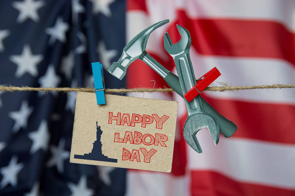 Happy Labor day american. Flag USA, cardboard hammer, wrench. grunge abstract card. soft image - Foto, Imagem