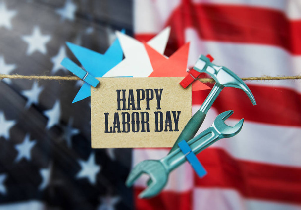 Happy Labor day american. Flag USA, cardboard hammer, wrench. grunge abstract card. soft image - Photo, Image