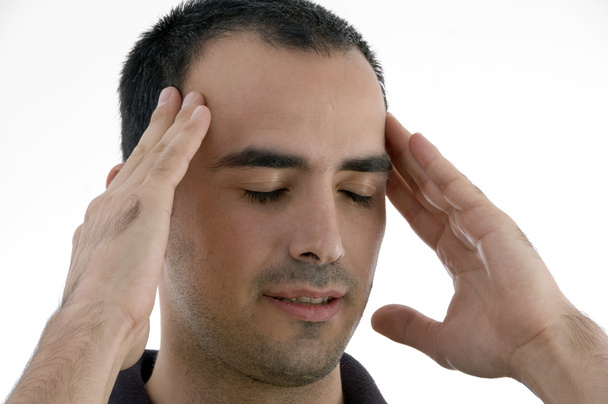 Young man having headache, in tension - Foto, afbeelding
