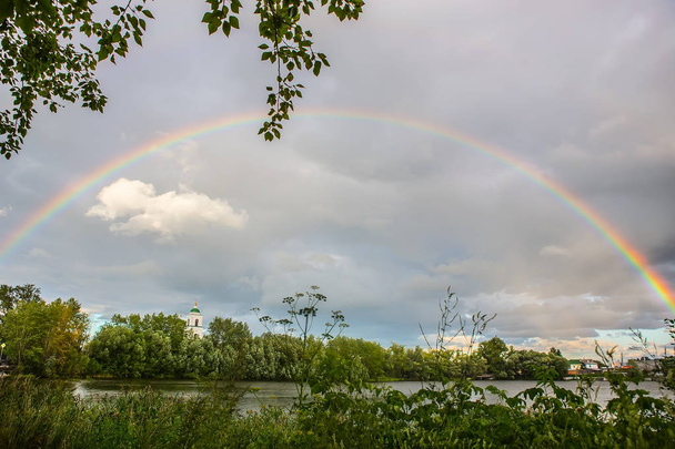 Rainbow over the river - Photo, image