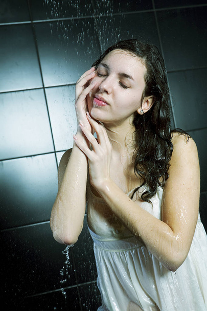 girl taking a shower - 写真・画像